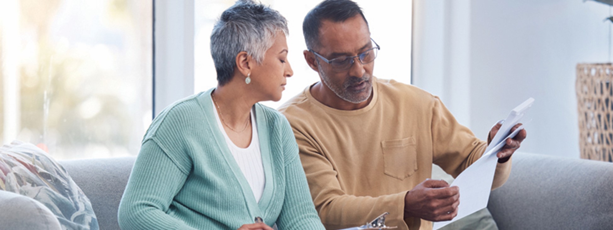 An older couple looking over paperwork