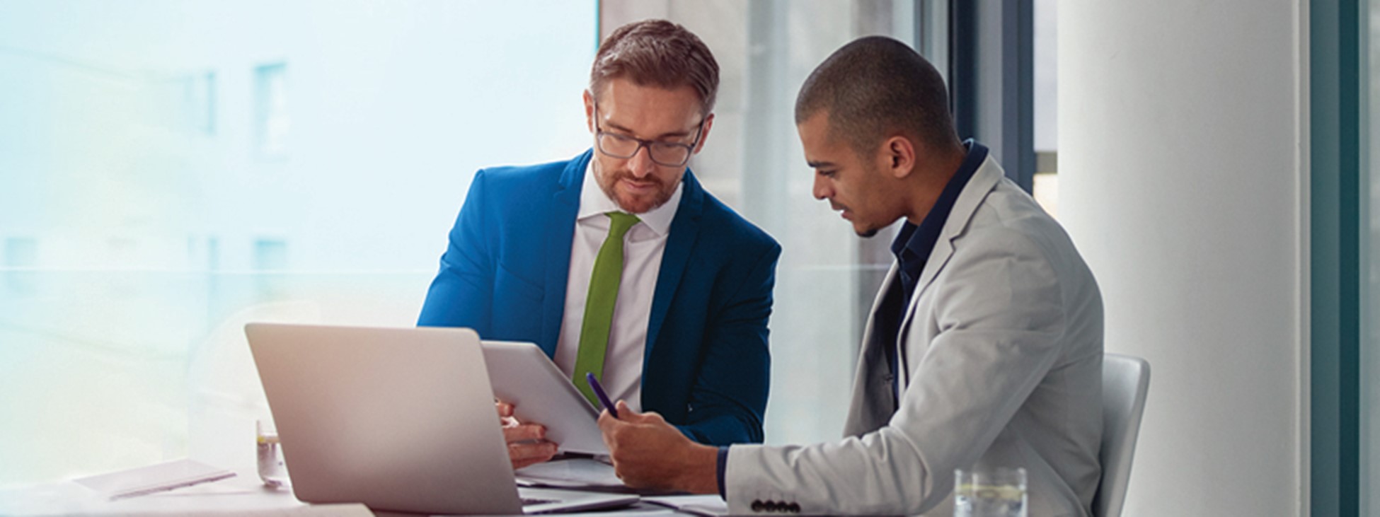 Two men looking at a document