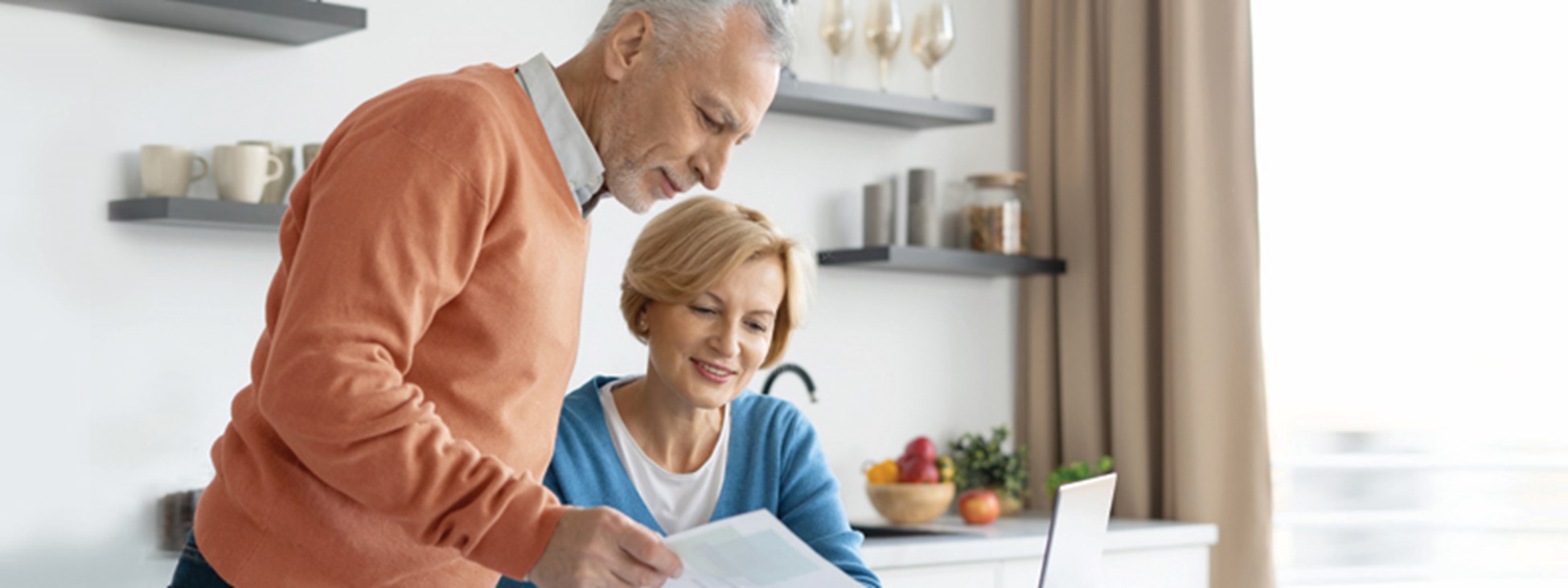 An Elderly couple looking over documents