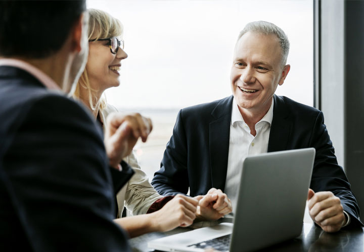 Man speaking to people in a meeting