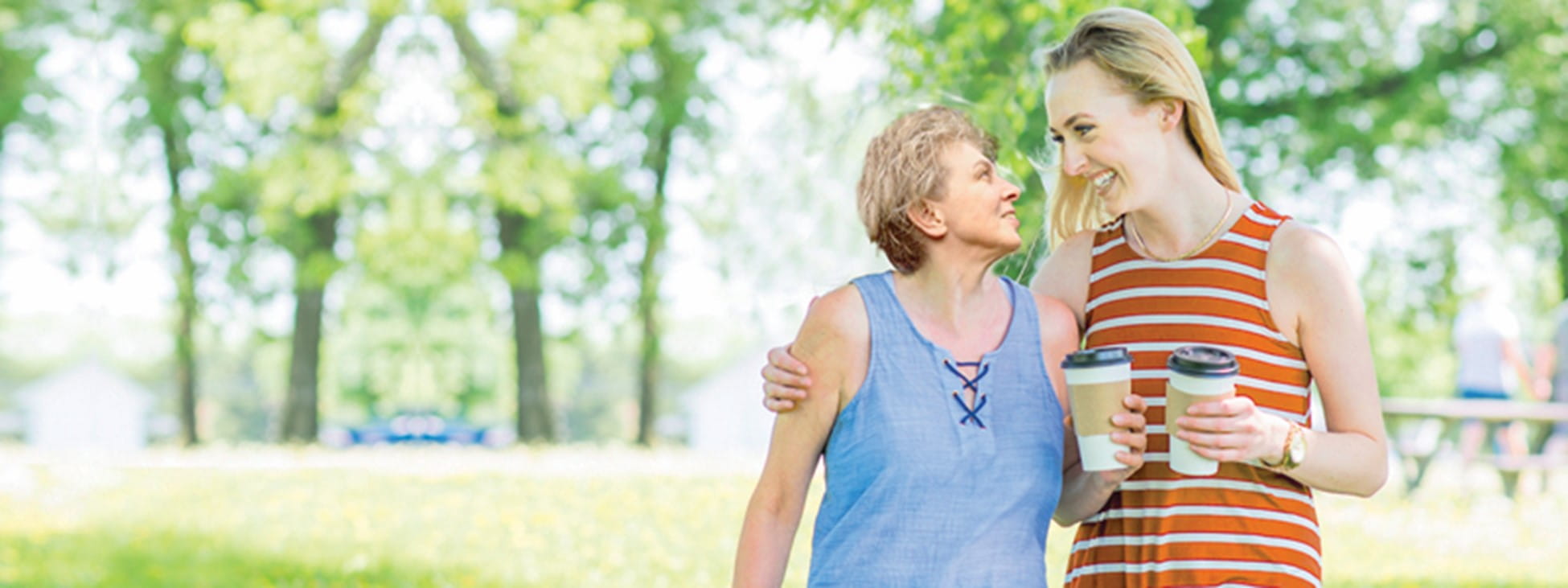 Two women smiling at one another