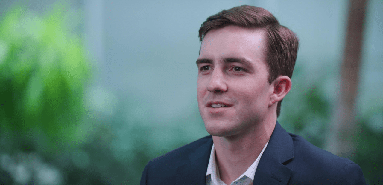 Headshot of Tripp Glover wearing a navy blazer